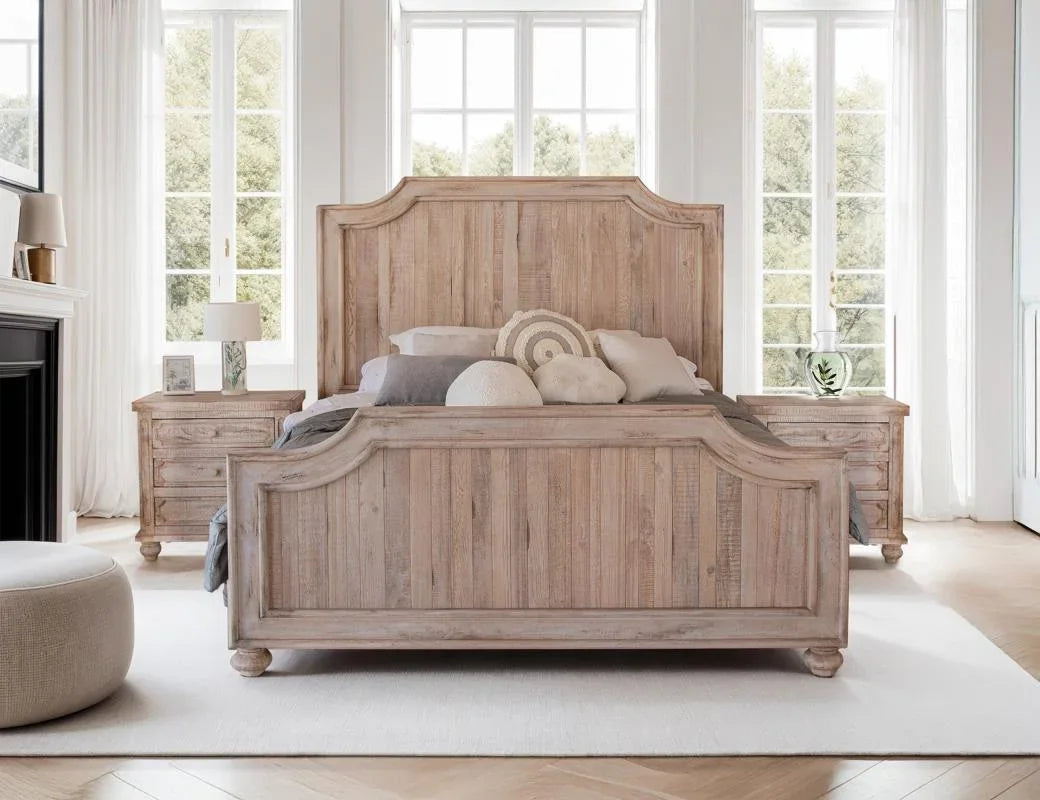Aruba bedroom collection — solid mango wood bed and nightstands in sand drift finish in a styled bedroom