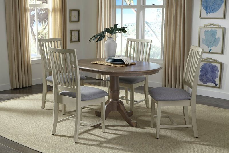 Mission Chairs in a painted finish with cushioned seats at the 36" Round Extension Bistro Table - Barewood