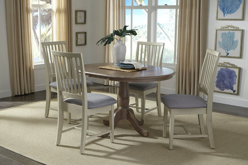 Mission Chairs in a painted finish with cushioned seats at the 36" Round Extension Bistro Table - Barewood